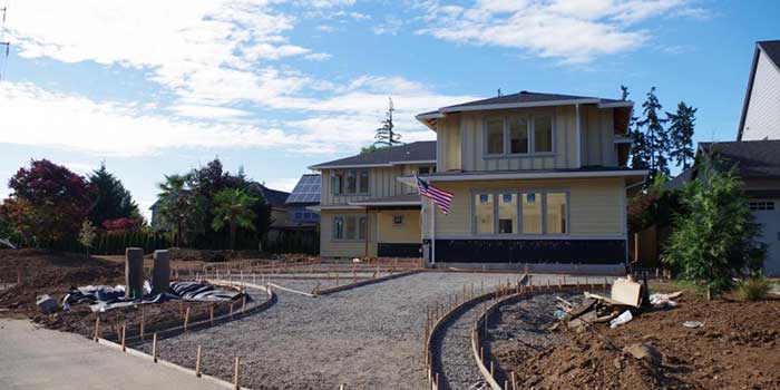 Construction site near the house having a flag of USA