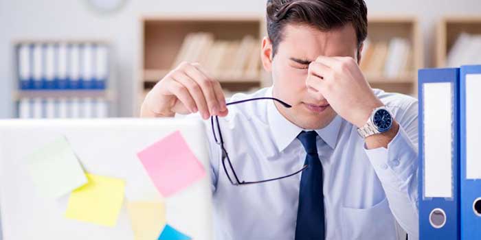 Man feeling tired in the office