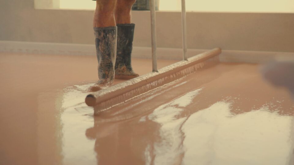 Applying gypsum underlayment for smooth, level flooring